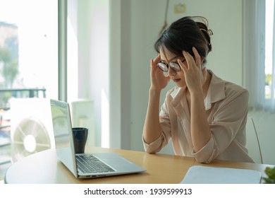 Asian businesswoman gets stressed while having a problem at work in the office.	 - Shutterstock ID 1939599913