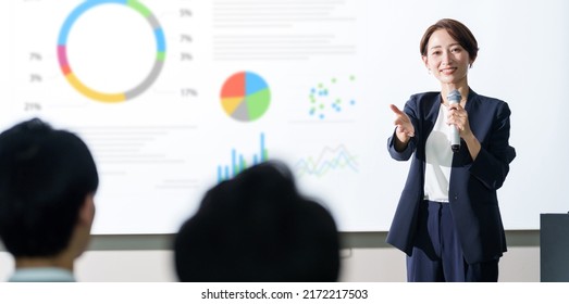 asian businesswoman giving a presentation at a seminar - Powered by Shutterstock