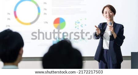 asian businesswoman giving a presentation at a seminar
