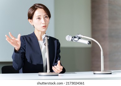 asian businesswoman giving a press conference - Powered by Shutterstock