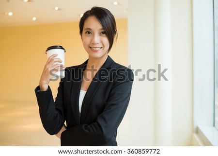 Asian Businesswoman holding a coffee