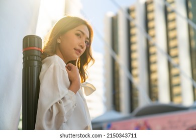  Asian Businesswoman Office Worker In Working Dress And High Heels Walking Down The Stairs At Railway Station Urban City Street . Business Woman Go To Working At Office Center In Morning Rush Hour