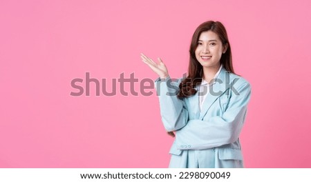 Asian businesswoman portrait on pink background