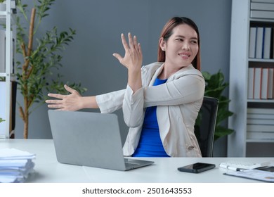 Asian businesswoman sitting in office stressed and fatigued from overwork on financial matters on office desk. - Powered by Shutterstock