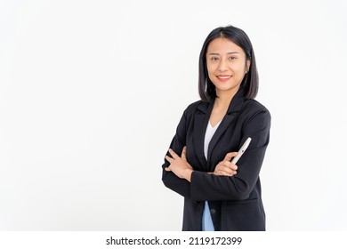 Asian Businesswoman Smiling And Holding Smartphone. Beautiful Asian Woman Standing With Crossed Arms.  Female Portraits. Bank Staff, Accountant, Administration, Officer