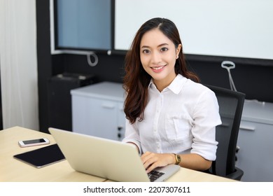 Asian Businesswoman Smiling Using Her Laptop Stock Photo 2207307611 ...