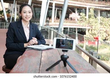 Asian Businesswoman Use Smartphone For Online Live Streaming. Woman Recording Video Blog. Vlogger Presenting Business Vlog.