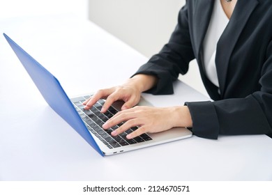 Asian Businesswoman Using The Laptop At Office, No Face