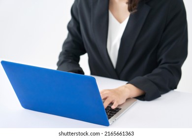 Asian Businesswoman Using The Laptop At The Office, No Face