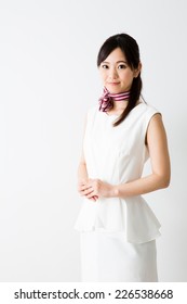 asian businesswoman wearing white one piece dress on white background
