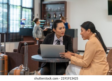 Asian Businesswoman Working On Laptop Computer At Airport Private Lounge While Waiting For Boarding In Airport Terminal. Airline Service Business, Airplane Transportation And Holiday Vacation Concept.