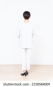 Asian businesswoman's whole body on white background