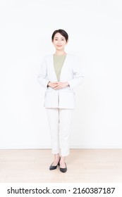 Asian businesswoman's whole body on white background