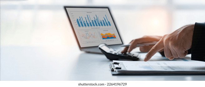 Asian businesswomen work using laptops and tablets, calculators to calculate make an account analysis report real estate investment information financial system concept and tax.