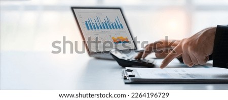 Asian businesswomen work using laptops and tablets, calculators to calculate make an account analysis report real estate investment information financial system concept and tax.