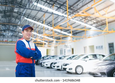 Asian Car Mechanic, Smiling And Happy, Car Repair Service Center, Blurred Background, Blurred Background For The Industry