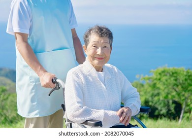 Asian Caregiver And Senior Woman, Out Door