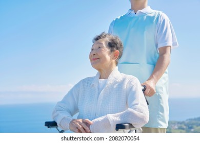 Asian Caregiver And Senior Woman, Out Door