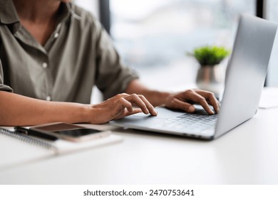 Asian casual businesswoman use laptop to working about growth finance report of new startup project. - Powered by Shutterstock