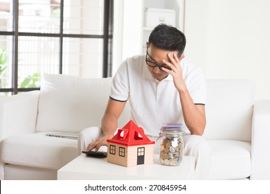 Asian Casual Male And House Loan