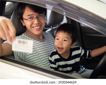 Asian Child Boy And Father Inside Car With Happy Smiling And Wow Face, Dad Holding Credit Card. Concept Of Car Rental, Sale Shopping, Credit Card Advertising. 