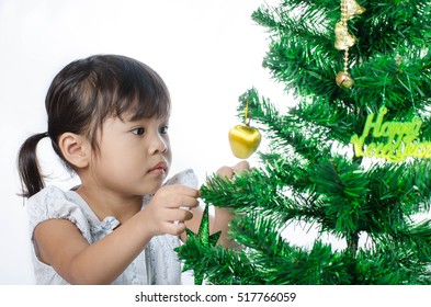 Asian Child And Christmas Tree On White Background