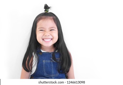 Asian Child Cute Or Kid Girl And Kindergarten Student Happy Smile White Teeth And Laugh Thinking For New Idea With Wear Dungarees Jean At Dental Or Pre School On White Background With Space Isolated