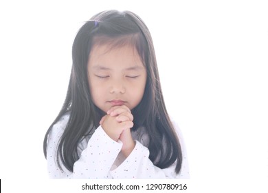 Asian Child Cute Or Kid Girl Smile With Hold Hand And Pray Or Beg And Sorry For Peaceful World With Wear White Clothes On White Space Background Isolated