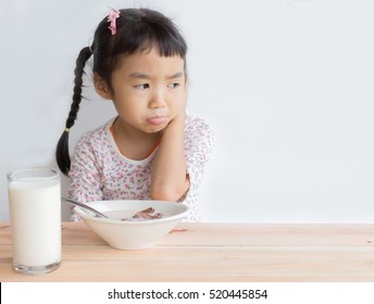 Asian Child Does Not Like Eating Cereal With Milk , She Is Bored With Food