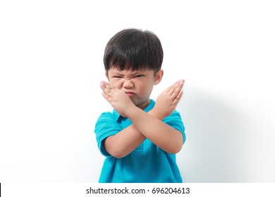 Asian Child Doing NO And STOP Gesture. Negative Human Emotion, Facial Expression, Sign, Gesture, Body Language.