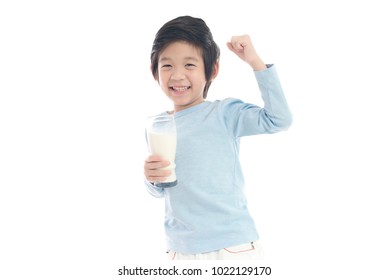Asian Child Drinking Milk From A Glass On White Background Isolated