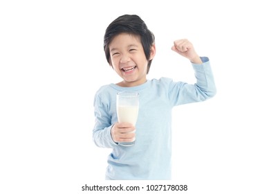 Asian Child Drinking Milk From A Glass On White Background Isolated