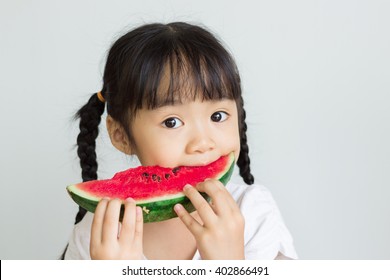 Asian Child Eat Watermelon