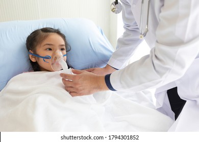 Asian Child Girl Patient Receiving Artificial Ventilation From Doctor In Hospital