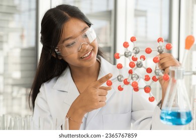 Asian child girl scientists learning science and doing analysis in the laboratory. Science and education, researcher and discovery concept - Powered by Shutterstock