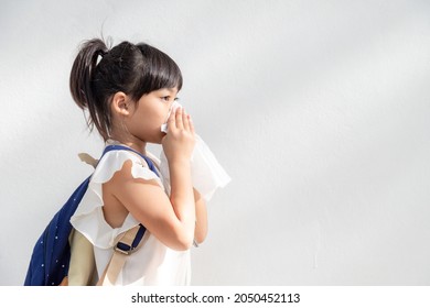 Asian Child Girl Sick With Sneezing On The Nose And Cold Cough On Tissue Paper Because Weak Or Virus And Bacteria From Dust Weather 