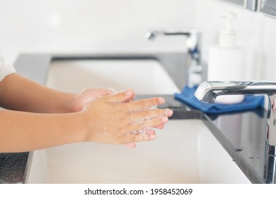 Asian Child Girl Student Washing Hands At The Outdoor Wash Basin In The School. Preventing Contagious Diseases, Plague. Kids Health, Protecting The Virus Covid - 19 , Cleaning, Running Water.