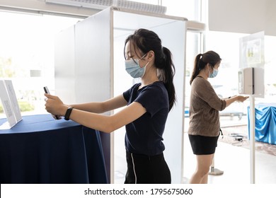 Asian Child Girl Using Phone Scanning Barcode,scan QR Code For Registration At Screening Point Or Checkpoint For COVID-19 Coronavirus,people Are Registering Before Entry The Service In Various Places