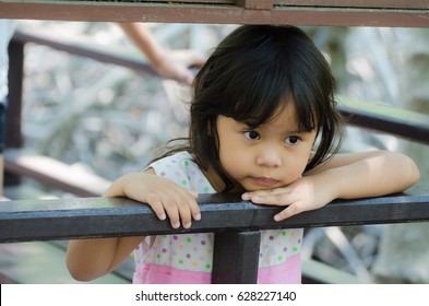 Asian Child Lonely In A Park