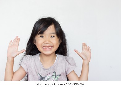 Asian Child Play Peekaboo On White Background