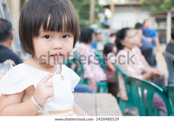 Asian child relax in holiday. Black hair happy
and relax in holiday.
