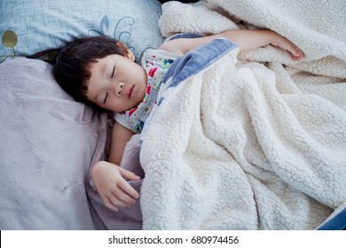 Asian Child Sleeping On Bed / Feeling Sick
