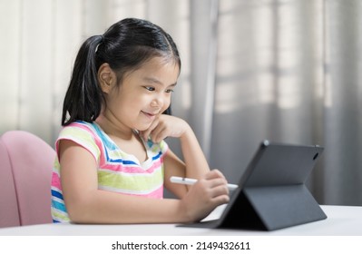 Asian Child Student Studying Online Class On Computer Or Kid Girl Enjoy Smiling Writing Or Art Drawing By Touch Pen On Tablet Screen To Video Call Learning Write Or Person Happy Learn From Home School