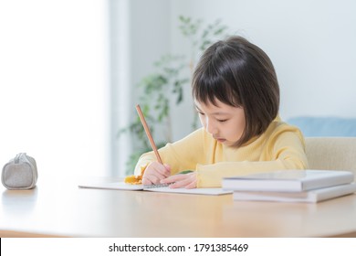 Asian Child Studying In The Room

