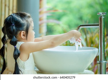 Asian Child Washing Hands