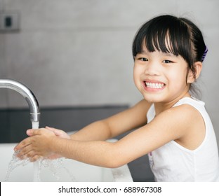 Asian Child Washing Hands