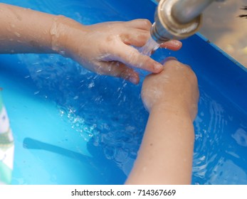 Asian Child Washing Hands