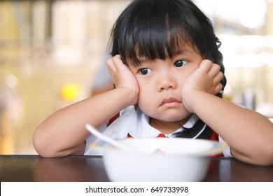 Asian Children Cute Or Kid Girl Student Anorexia Or Sad With Vacant And Prop Up Or Hand To Cheek On Food Table For Breakfast Before Going To School For Study