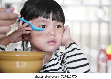 Asian Children Cute Or Kid Girl Student Anorexia Or Sad With Mother Feed And Vacant With Prop Up Or Hand To Cheek On Food Table For Breakfast Before Going To School For Study