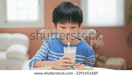 asian children eat unhealthy high calorie sugary junk food such as fried chicken freinch fries burgers bubble tea